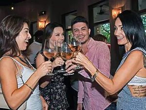 Group of friends toasting with rosé wine — Casa Sensei, Fort Lauderdale