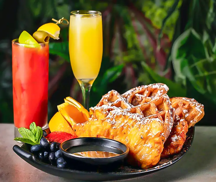 Togarashi fried chicken and homemade waffles, served with fresh fruit, maple syrup, a Bloody Mary and a mimosa — Casa Sensei, Fort Lauderdale