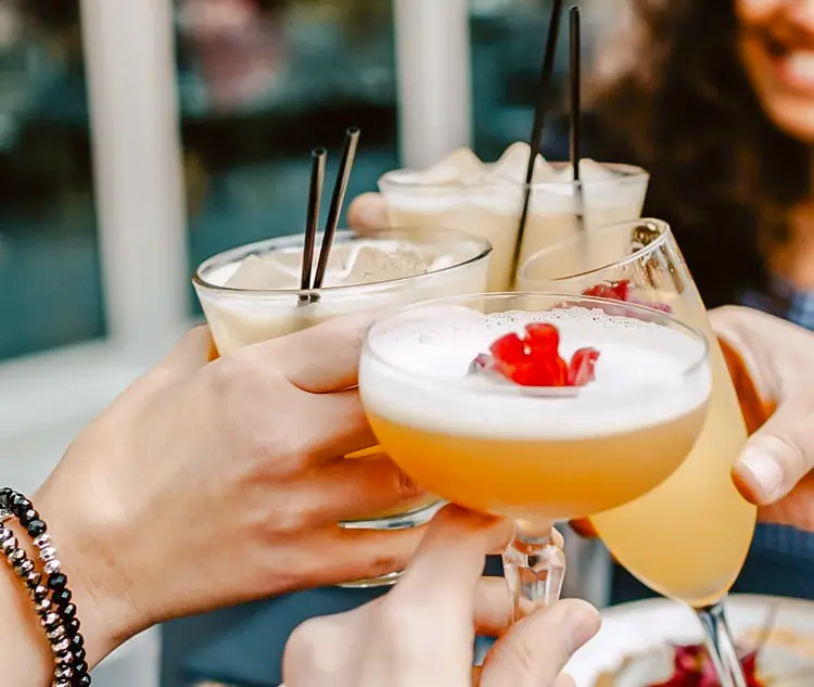 Friends clinking colorful cocktails and drinks — Casa Sensei, Fort Lauderdale